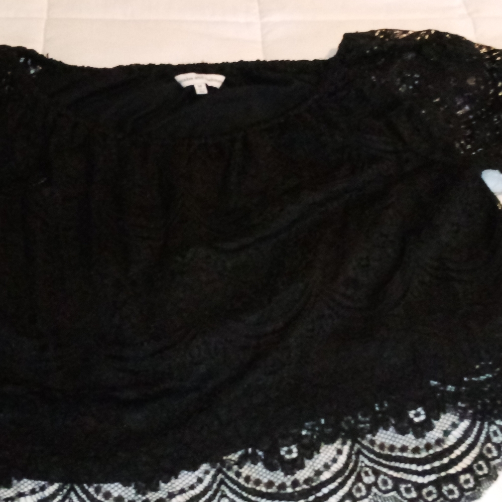 Mid-drift black lace top.